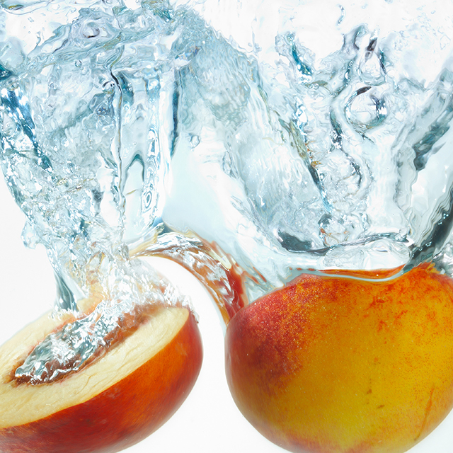 Photo of peaches in water.
