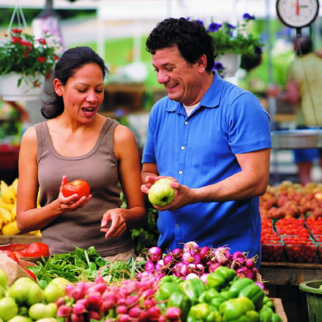 Photo of people at a farmers' market.