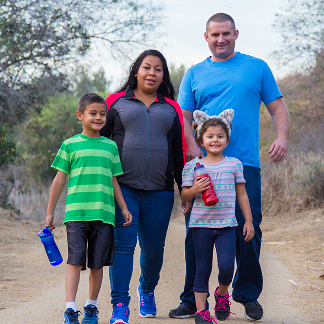 Photo of Champion family going on a walk.