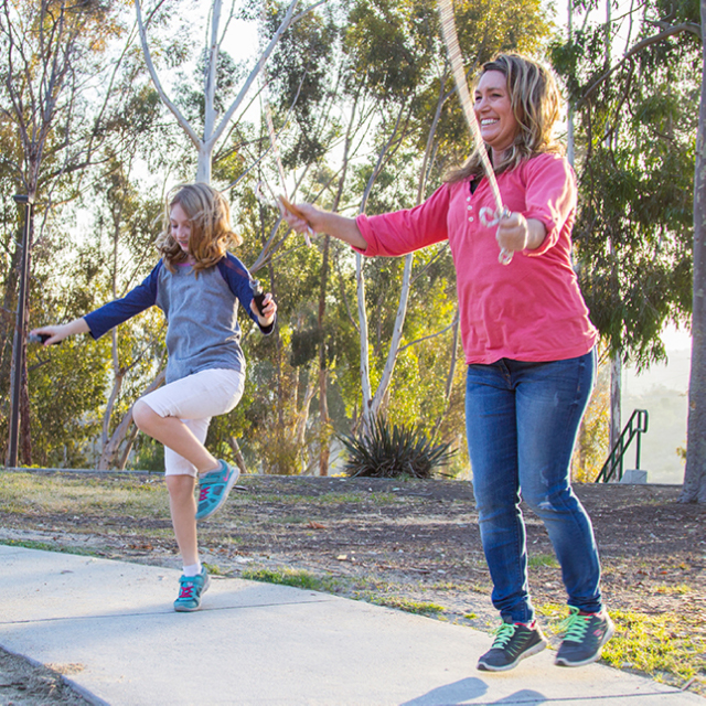 Photo of mom and daughter jump-roping.