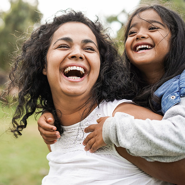 A mother and daughter celebrate their journey of staying active and healthy together as a family.